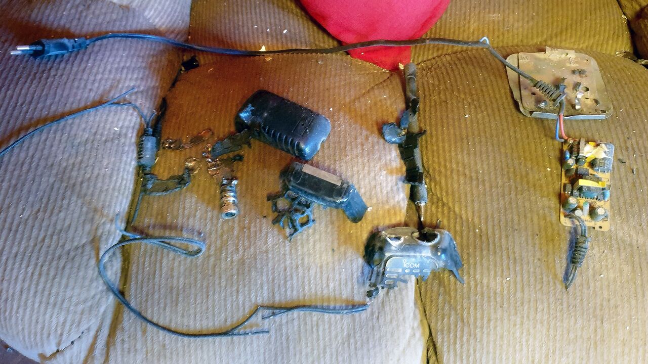 This picture shows on Sept. 18, 2024, the remains of an exploded walkie-talkie device with the Icom logo on a couch inside a house in Baalbek, a Hezbollah stronghold in eastern Lebanon. 